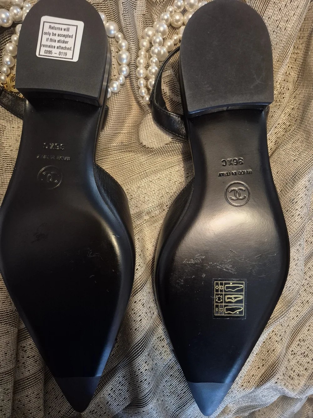 CHANEL black leather pointed-toe flats with pearls